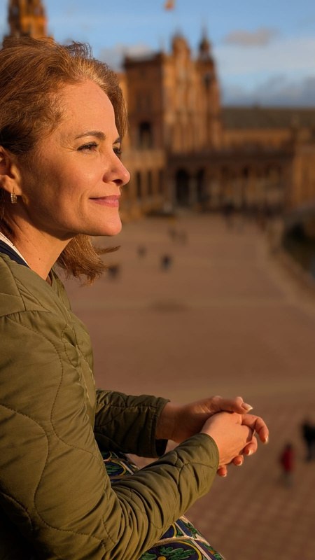 Francesca Facio seated outside at golden hour