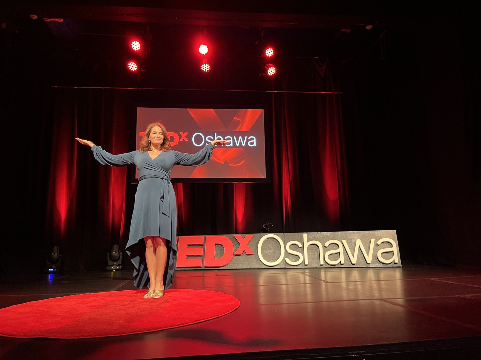 Francesca Facio speaking on a TEDx stage