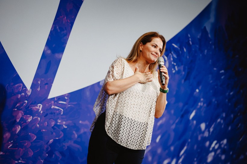 Francesca Facio speaking with microphone