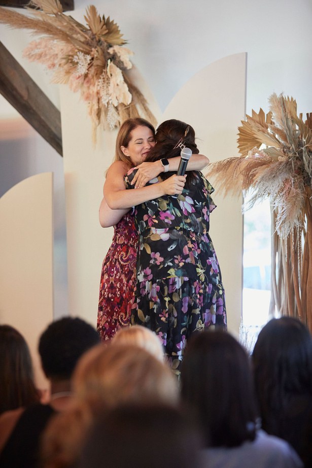 Francesca Facio hugging an audience member